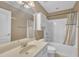 Bathroom with a combined shower and tub, large mirror, and neutral colors at 85 Clubhouse Dr, Youngsville, NC 27596