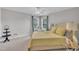 Bedroom with light neutral carpet, ceiling fan, and a comfy bed with throw pillows at 85 Clubhouse Dr, Youngsville, NC 27596