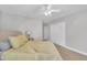 Bedroom with view of closet and doorway featuring neutral colored walls and carpet and ceiling fan at 85 Clubhouse Dr, Youngsville, NC 27596