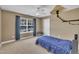 Comfortable bedroom with natural light, complemented by simple furnishings and a calming color scheme at 85 Clubhouse Dr, Youngsville, NC 27596