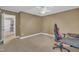 Bedroom with neutral colors, gaming chair and views of hallway and closet at 85 Clubhouse Dr, Youngsville, NC 27596