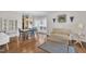 Inviting dining area with hardwood floors, elegant furnishings, and a sunlit window at 85 Clubhouse Dr, Youngsville, NC 27596