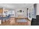 Bright open-concept space with hardwood floors connecting to the dining room with stylish furniture and decor at 85 Clubhouse Dr, Youngsville, NC 27596