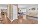 Open-concept space with hardwood floors connecting to the dining room with stylish furniture and decor at 85 Clubhouse Dr, Youngsville, NC 27596
