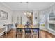 Dining room showcasing a chandelier, hardwood floors, and elegant decor at 85 Clubhouse Dr, Youngsville, NC 27596