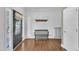 Inviting entryway with hardwood floors, a bench, and natural light streaming through the door at 85 Clubhouse Dr, Youngsville, NC 27596