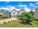 Charming two-story home with a well-manicured lawn and ample parking space at 85 Clubhouse Dr, Youngsville, NC 27596