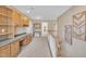 Upstairs hallway featuring wood staircase, built in desk and storage cabinet at 85 Clubhouse Dr, Youngsville, NC 27596