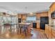 Spacious kitchen featuring an island, bar stools, and modern appliances at 85 Clubhouse Dr, Youngsville, NC 27596