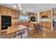 Well-appointed kitchen boasting a central island, hardwood floors, and ample storage at 85 Clubhouse Dr, Youngsville, NC 27596