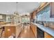 Open kitchen with an island, pendant lighting, and hardwood floors at 85 Clubhouse Dr, Youngsville, NC 27596