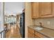 A modern kitchen with stainless steel appliances and hardwood floors at 85 Clubhouse Dr, Youngsville, NC 27596