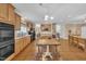 Modern kitchen featuring stainless steel appliances, hardwood floors, and an open layout at 85 Clubhouse Dr, Youngsville, NC 27596