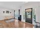 Bright living room with hardwood floors, stylish furnishings, and natural light streaming through the windows at 85 Clubhouse Dr, Youngsville, NC 27596