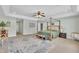 Bright main bedroom with neutral walls, ceiling fan, and a decorative rug, provides a tranquil atmosphere at 85 Clubhouse Dr, Youngsville, NC 27596