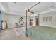A calm main bedroom with a four-poster bed, neutral walls, and a decorative rug offers a peaceful getaway at 85 Clubhouse Dr, Youngsville, NC 27596