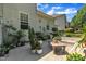 The stone patio area is enhanced with potted plants and outdoor seating, perfect for enjoying the outdoors at 85 Clubhouse Dr, Youngsville, NC 27596