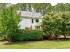 Beautiful backyard showcasing the home's exterior, a well-maintained lawn, and mature trees for added privacy at 8536 Wolverton Fields Dr, Wake Forest, NC 27587
