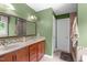 Bathroom featuring a double vanity with a stone countertop and a walk-in shower at 8536 Wolverton Fields Dr, Wake Forest, NC 27587