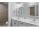 Modern bathroom featuring dual sinks, white cabinets, and a walk-in shower at 8536 Wolverton Fields Dr, Wake Forest, NC 27587