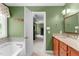 A view from the bathroom into the primary bedroom at 8536 Wolverton Fields Dr, Wake Forest, NC 27587