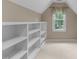 Bedroom showcases beige carpet, and a custom white built in bookshelf at 8536 Wolverton Fields Dr, Wake Forest, NC 27587