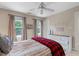 Bright bedroom with ceiling fan and large windows at 8536 Wolverton Fields Dr, Wake Forest, NC 27587