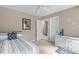 Bedroom with ceiling fan, artwork, and view to hallway at 8536 Wolverton Fields Dr, Wake Forest, NC 27587