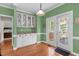 Bright breakfast nook featuring built-in cabinets, granite counters, and access to the outdoor porch at 8536 Wolverton Fields Dr, Wake Forest, NC 27587