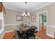 Dining room featuring wood table, bench seating, chandelier, and hardwood floors at 8536 Wolverton Fields Dr, Wake Forest, NC 27587