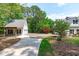 Long driveway leading to a detached garage and the main house, surrounded by beautiful landscaping at 8536 Wolverton Fields Dr, Wake Forest, NC 27587