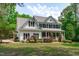 Charming two-story house featuring a classic design, neat landscaping, and inviting front porch at 8536 Wolverton Fields Dr, Wake Forest, NC 27587