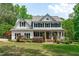 Beautiful two-story home with a welcoming front porch and a well-manicured lawn at 8536 Wolverton Fields Dr, Wake Forest, NC 27587