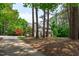 Traditional home with mature trees, manicured lawn, and a long driveway leading to the residence at 8536 Wolverton Fields Dr, Wake Forest, NC 27587