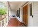 Cozy front porch with a swing, wooden floor, and a welcoming atmosphere at 8536 Wolverton Fields Dr, Wake Forest, NC 27587