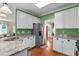 Modern kitchen featuring granite countertops, stainless steel appliances, and ample cabinet space at 8536 Wolverton Fields Dr, Wake Forest, NC 27587