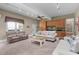 Spacious living room with neutral tones, ample seating, built-in cabinets, and natural light at 8536 Wolverton Fields Dr, Wake Forest, NC 27587