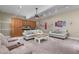 Comfortable living room with built-in cabinets, ceiling fan, and ample seating perfect for entertaining at 8536 Wolverton Fields Dr, Wake Forest, NC 27587