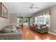 Open living room flowing into kitchen featuring hardwood floors, comfortable seating, and lots of natural light at 8536 Wolverton Fields Dr, Wake Forest, NC 27587