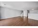 Spacious living room with hardwood floors and natural light, perfect for entertaining or relaxing at 8630 Neuse Landing # 105, Raleigh, NC 27616