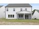 Backyard view of a new construction featuring a screened-in porch at 88 Mable Court # 17, Lillington, NC 27546