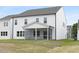 Backyard view of a new construction featuring a screened-in porch and lawn at 88 Mable Court # 17, Lillington, NC 27546
