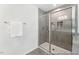Modern bathroom featuring a glass shower with gray tile surround and a convenient built-in shelving niche at 88 Mable Court # 17, Lillington, NC 27546