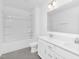 Bright bathroom featuring a double vanity and a shower-tub combo at 88 Mable Court # 17, Lillington, NC 27546