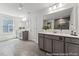 Bright bathroom with a double vanity, a large mirror, and tiled flooring at 88 Mable Court # 17, Lillington, NC 27546