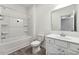 Bright bathroom features a shower-tub combo, single sink vanity, and a neutral color palette at 88 Mable Court # 17, Lillington, NC 27546