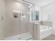 Elegant bathroom featuring a clear glass shower and separate tub at 88 Mable Court # 17, Lillington, NC 27546