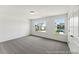 Spacious bedroom with carpet flooring, white walls, and lots of bright, natural light at 88 Mable Court # 17, Lillington, NC 27546