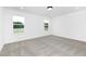 Bright bedroom with a neutral color scheme, gray carpet and two bright windows at 88 Mable Court # 17, Lillington, NC 27546