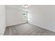 Cozy bedroom with soft carpeting, white walls, and a single window providing natural light at 88 Mable Court # 17, Lillington, NC 27546
